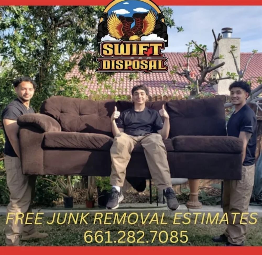 Swift Disposal junk removal crew carrying a couch on a job in Bakersfield, California